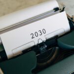 Close-up of a vintage typewriter with the year 2030 typed on paper symbolizing future concepts.