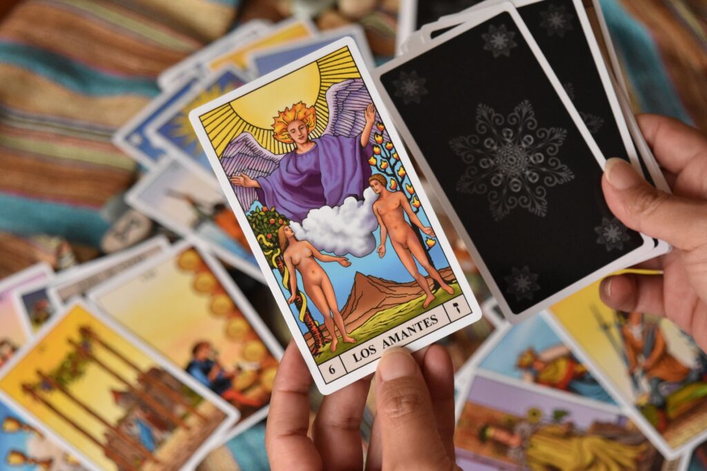 Tarot card reading with focus on The Lovers card, emphasizing symbolism and mysticism.