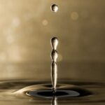 Captivating macro shot of water drop impact captured in stunning detail.