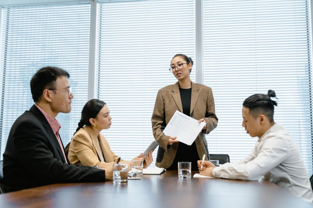 Business professionals in a modern office engaged in a teamwork session.