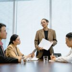 Business professionals in a modern office engaged in a teamwork session.