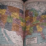 Classic vintage map of the United States in a historical book, showcasing detailed state borders.