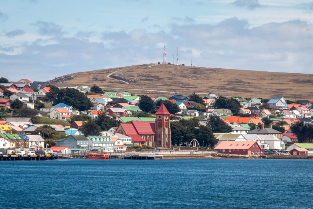 Charming harbor view of Stanley with colorful Victorian houses in the Falkland Islands.