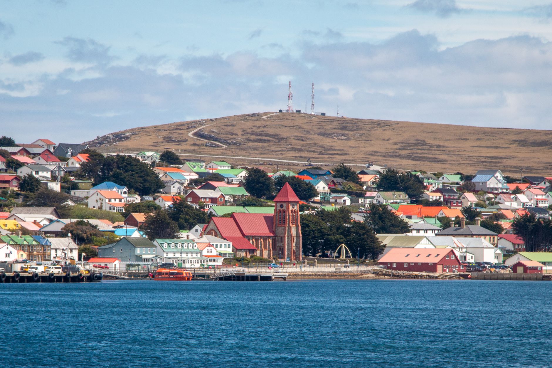 Charming harbor view of Stanley with colorful Victorian houses in the Falkland Islands.