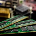 Detailed view of RAM sticks and microprocessors on a motherboard.