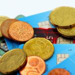 Close-up image of Euro coins and credit cards representing modern financial transactions.