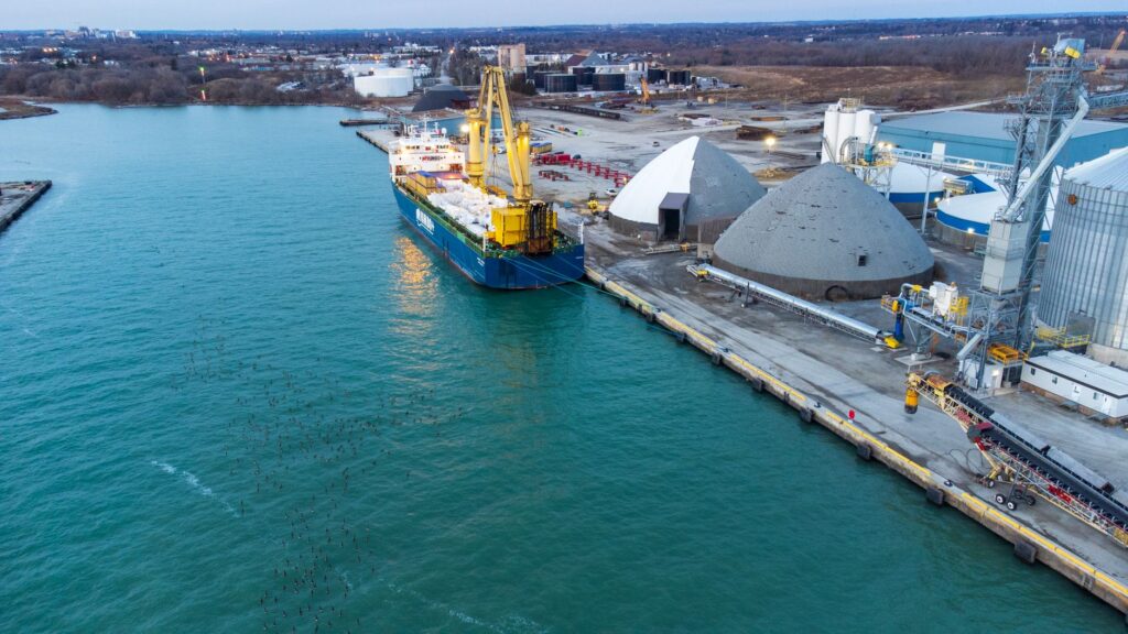Aerial view of a cargo ship docked at the industrial Port of Oshawa, Canada.