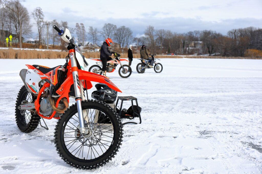 Motorcycles with studded tires racing on a frozen lake in Webster, New York.