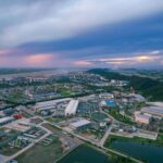 A stunning aerial view of an industrial area at sunset in Jiujiang, China.