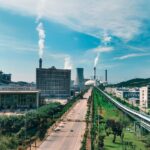 Aerial view of Jiujiang industrial area with factories and smoke stacks.