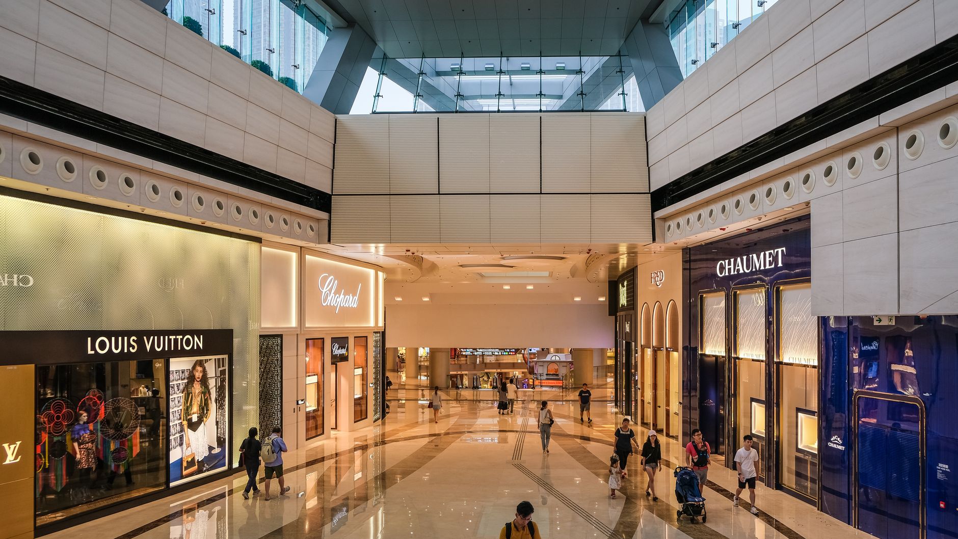 Explore the modern architecture of a luxury shopping mall in Hong Kong.
