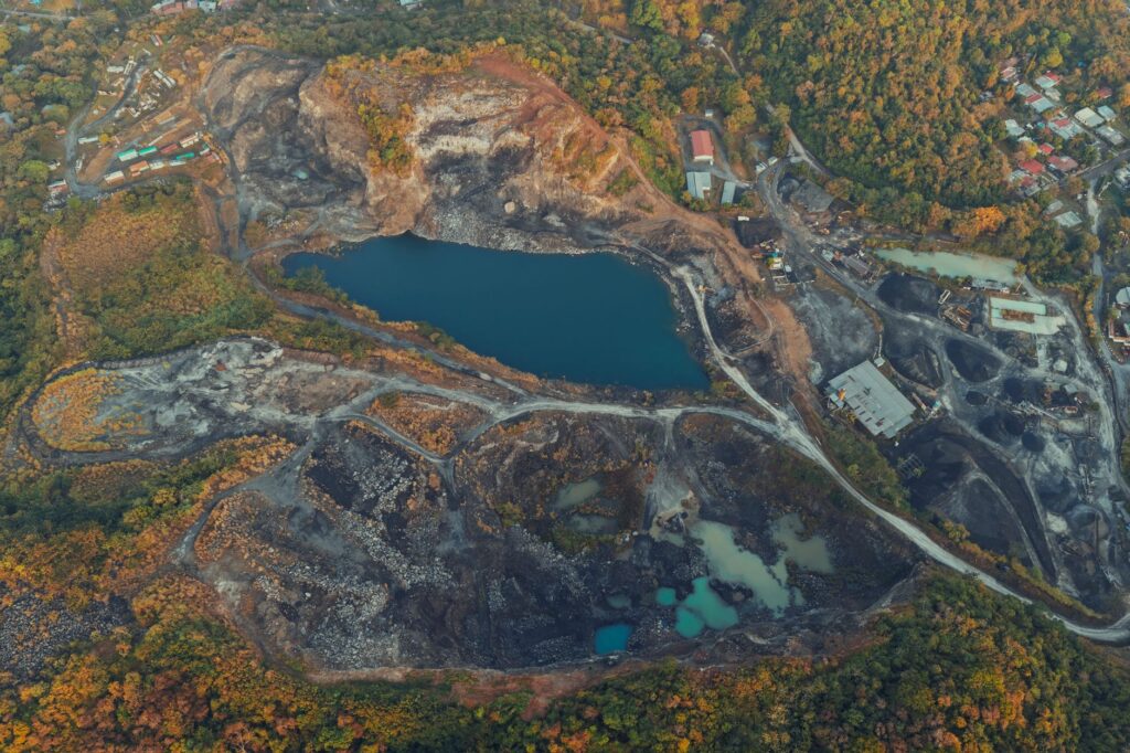 A stunning aerial view capturing a quarry and lake surrounded by lush greenery in Panama.