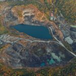 A stunning aerial view capturing a quarry and lake surrounded by lush greenery in Panama.