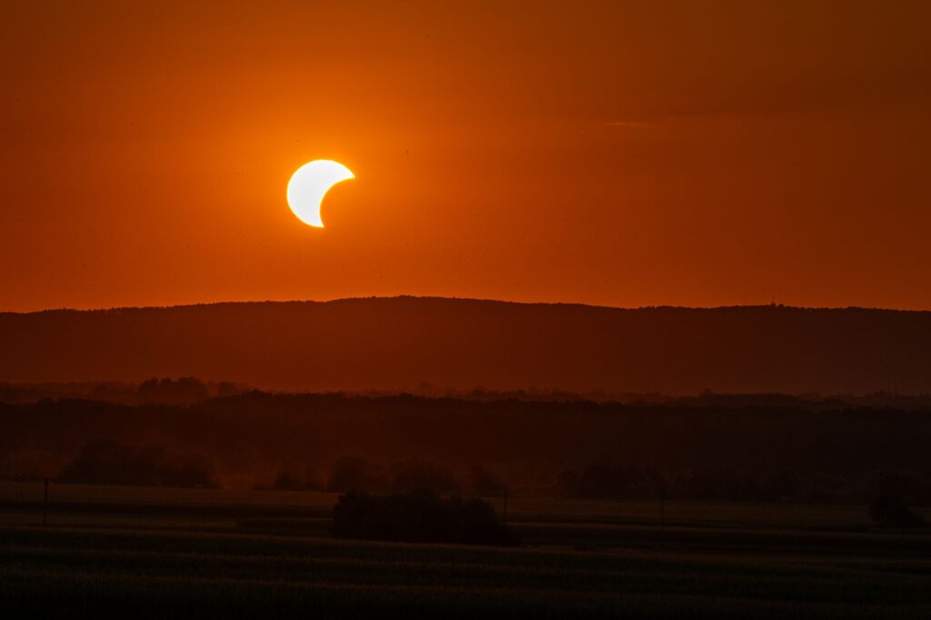 Stunning solar eclipse at sunset, captured over the landscape in Garešnica, Croatia.