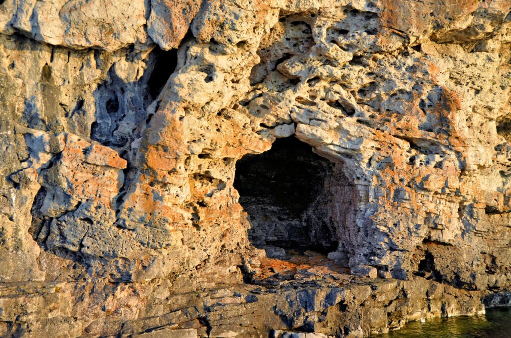 Rustic rock formation featuring small caves in Bruce Peninsula, Ontario.