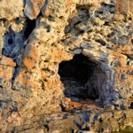Rustic rock formation featuring small caves in Bruce Peninsula, Ontario.