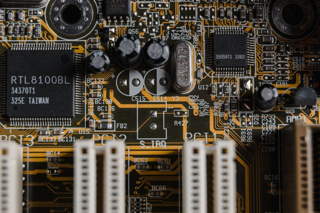 Detailed view of a motherboard with visible microchips and circuits.
