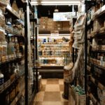 Explore a bustling Tokyo convenience store aisle packed with diverse products and merchandise.
