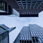 Low angle view of major skyscrapers in Frankfurt, Germany, showcasing urban architecture.