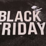 Bold 'Black Friday' text on a textured dark background, ideal for promotions.
