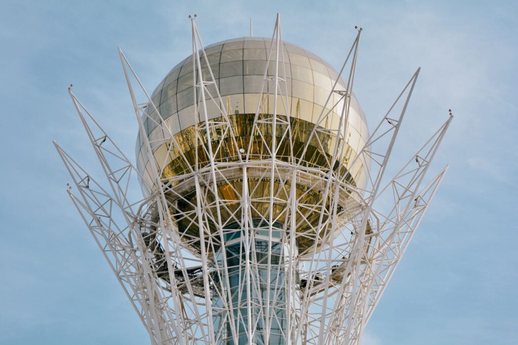 Close-up view of the iconic Baiterek Tower in Astana, Kazakhstan on a clear day.