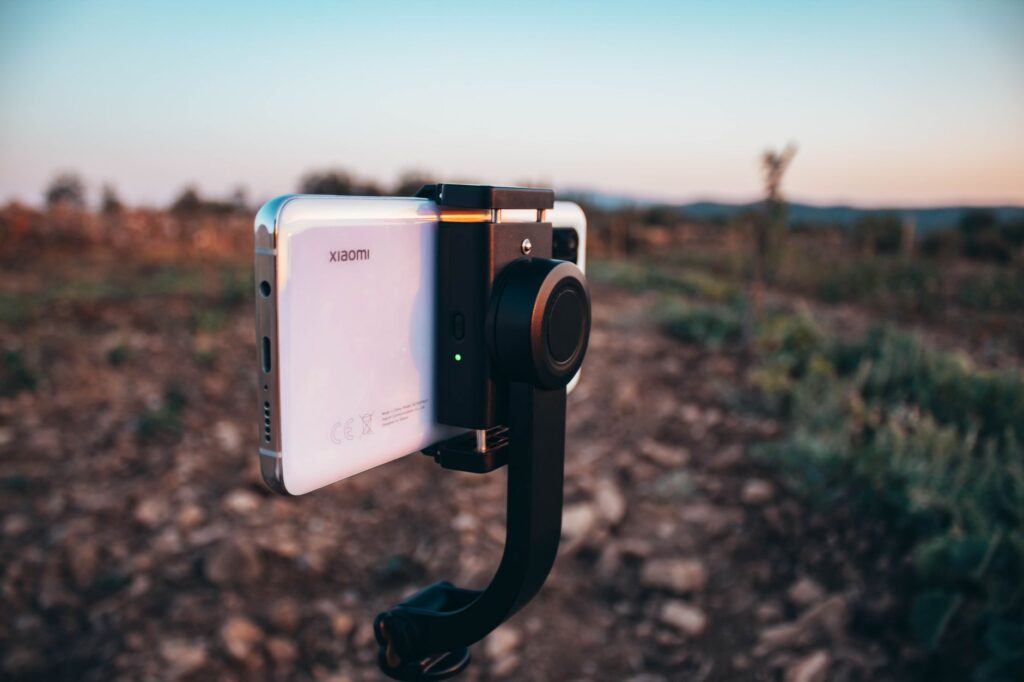 Smartphone on gimbal capturing a scenic sunset in Bekilli, Turkey.