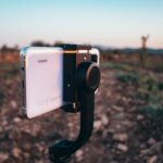 Smartphone on gimbal capturing a scenic sunset in Bekilli, Turkey.