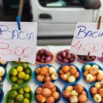 Colorful assortment of fruits and vegetables on display at a vibrant market stall.
