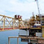 A detailed view of an offshore oil rig in Indonesian waters, highlighting industrial engineering.