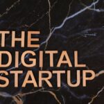 Wooden letters spelling 'The Digital Startup' on a dark marble background. Ideal for business and tech themes.