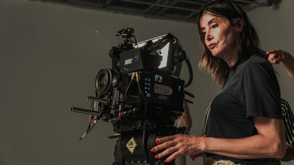 A female cinematographer operates a professional cinema camera on a film set in İstanbul, Türkiye.