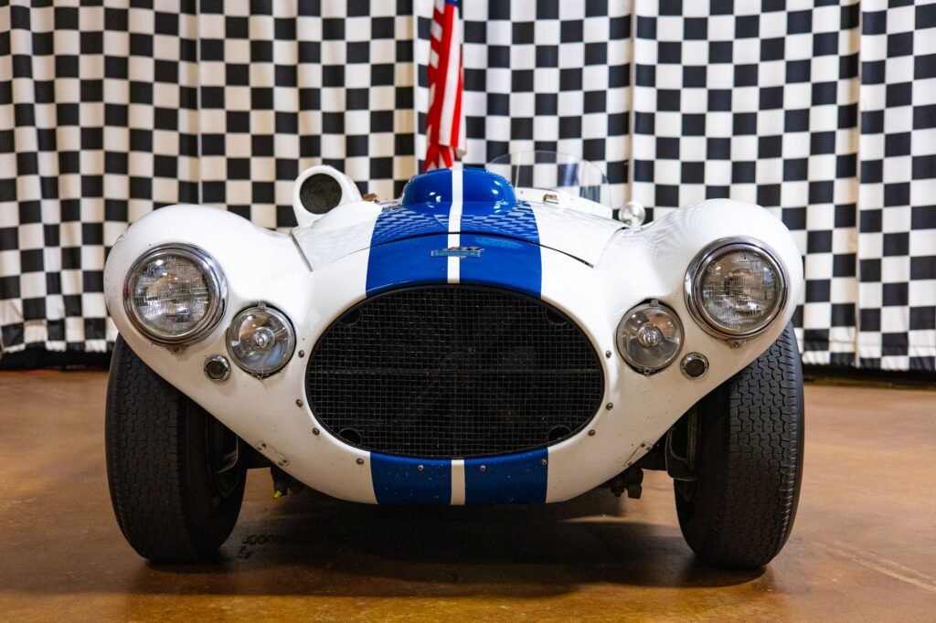 Front view of a classic Cunningham C-4R sports car at an exhibit in Philadelphia.
