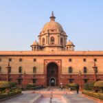 Explore the iconic Rashtrapati Bhavan with its historical architecture in sunny Delhi.