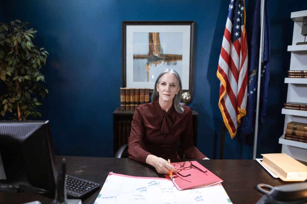 Professional woman in an office representing leadership and authority.
