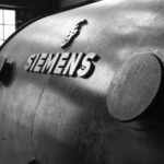 Black and white close-up of vintage Siemens machinery with industrial details.