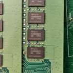 Detailed view of a green circuit board with SK hynix chips, showcasing electronic components.