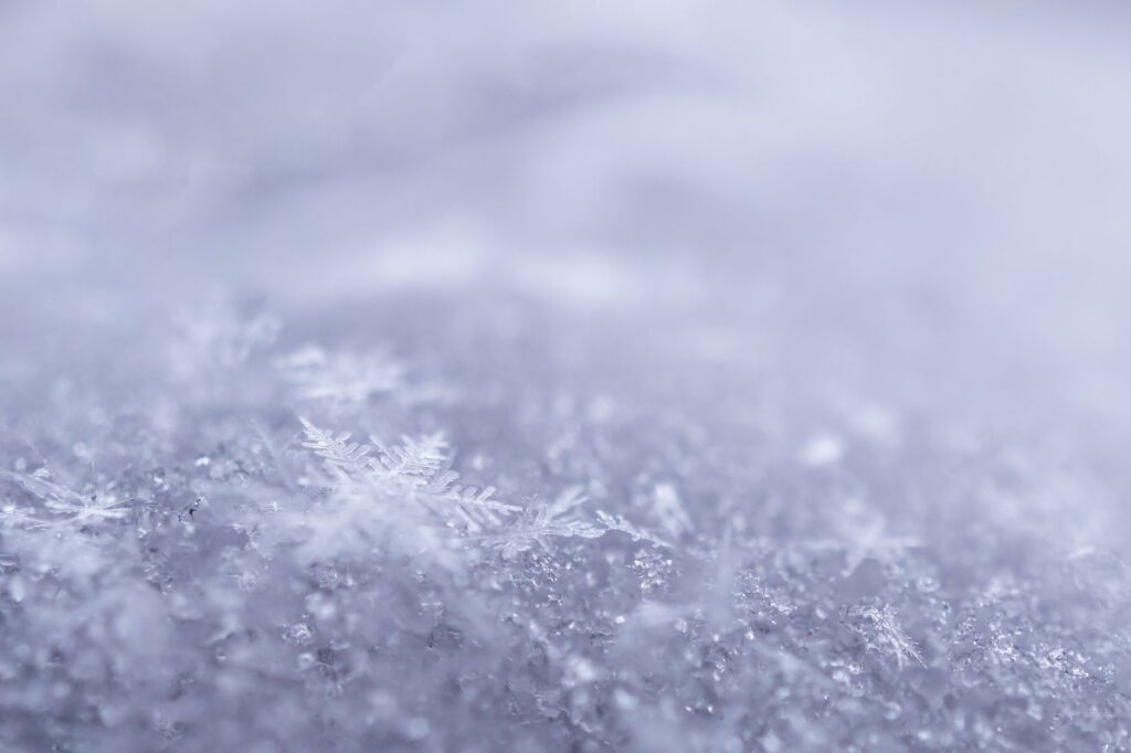 Intricate snowflakes captured in a beautiful frosty close-up highlighting winter's elegance.