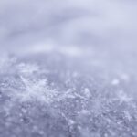 Intricate snowflakes captured in a beautiful frosty close-up highlighting winter's elegance.