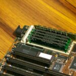 Detailed image of a vintage computer motherboard with RAM sticks.