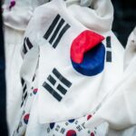 A detailed close-up of the wrinkled South Korean flag on fabric, showcasing its vibrant colors.