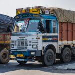 Vibrant Tata truck on an Indian highway near Deeg, Uttar Pradesh showcasing cultural designs.