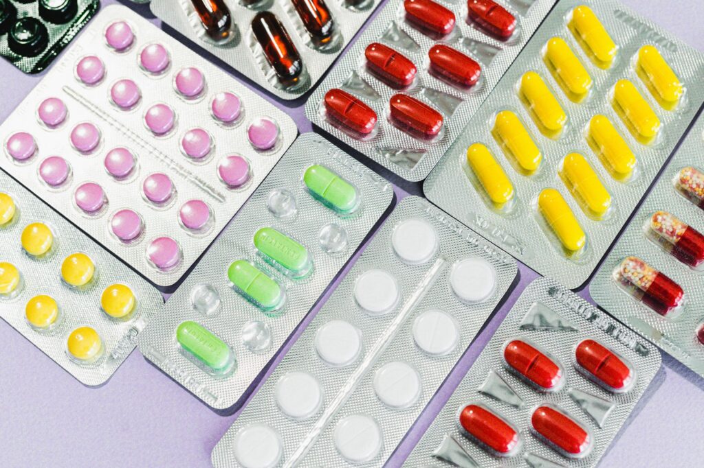 Vibrant blister packs showcasing a variety of colorful pills and capsules, a modern take on healthcare.