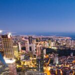 A breathtaking aerial view of Istanbul city lights at twilight, showcasing modern skyscrapers and vibrant skyline.