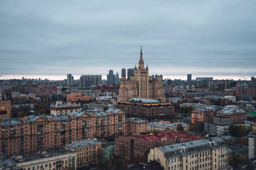 Aerial view of Moscow cityscape with famous Kudrinskaya Square Building on an overcast day.