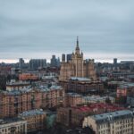 Aerial view of Moscow cityscape with famous Kudrinskaya Square Building on an overcast day.