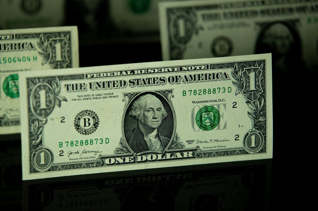 Detailed shot of a one dollar bill highlighting currency and finance themes.