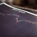 Detailed stock report showing market trends on paper charts.
